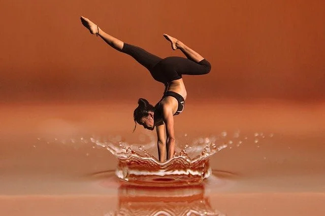 asian women dancing in the water splash