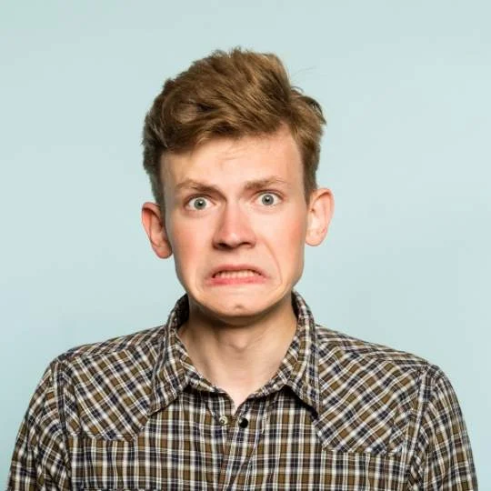 Man making awkward face - Awkward questions to ask people