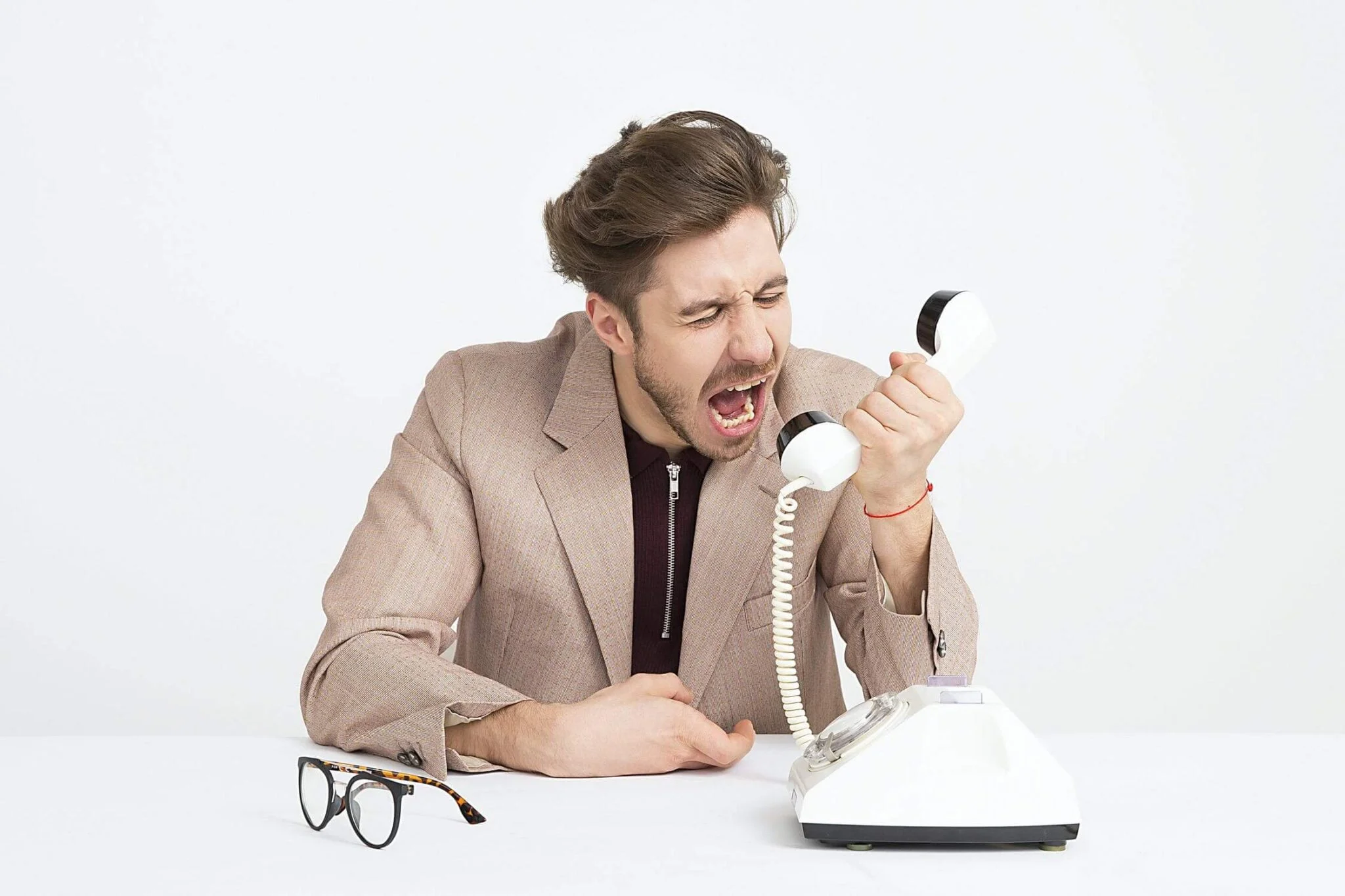 Angry Man Screaming on the Telephone