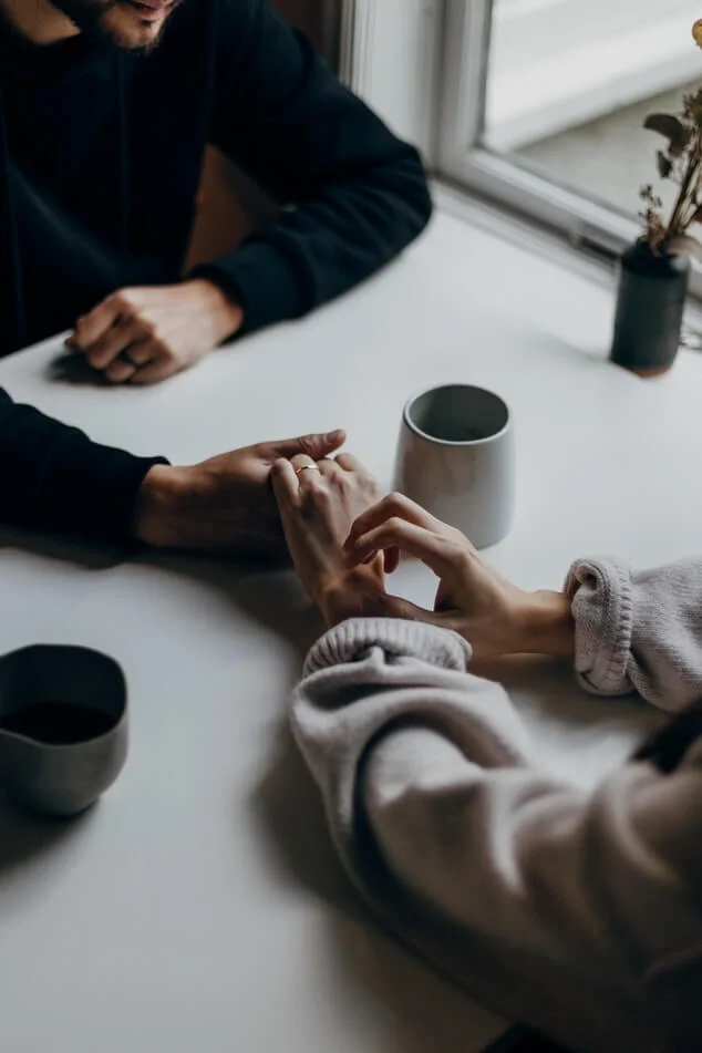 Young married couple talking to each other over coffee - How to avoid awkward silences