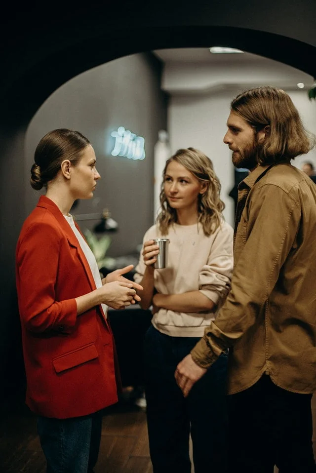 Three people talking to each other - How to improve communication skills