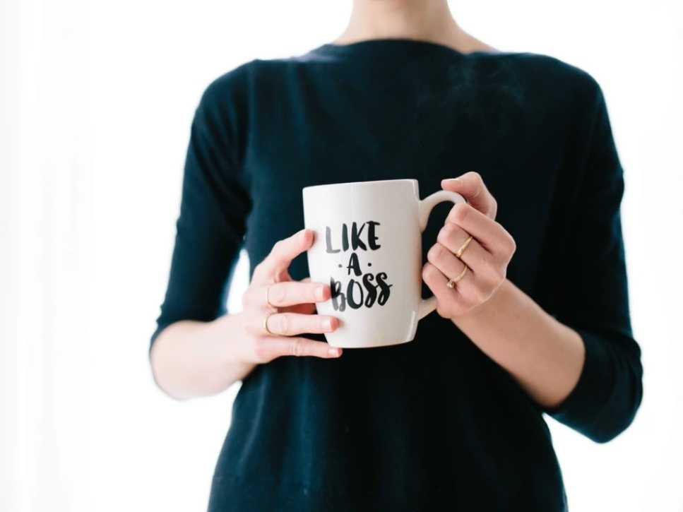 Woman holding a mug with the words like a boss