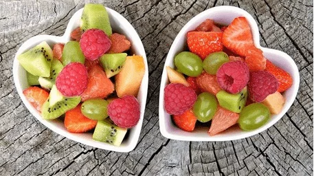 Bowl of mixed fruits in a heart shaped container - paragraphs for her
