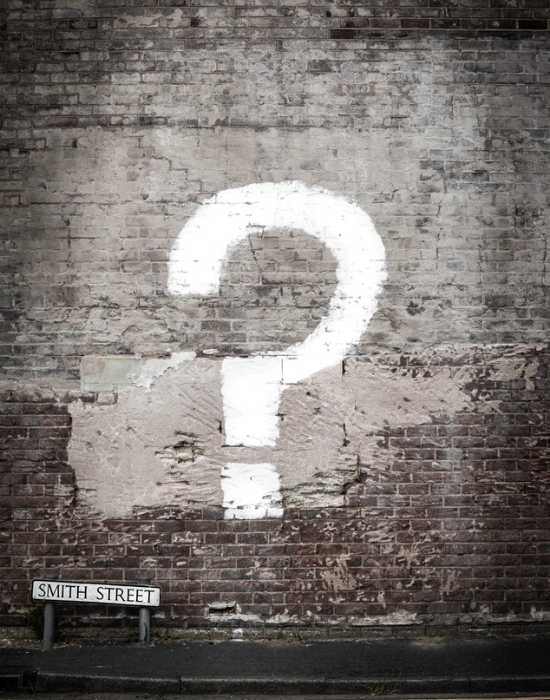 question mark painted over a wall