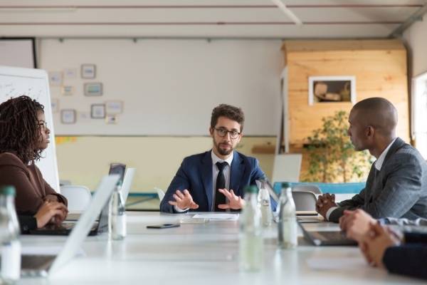 A group of people meeting in the conference room - communication skills of a great manager