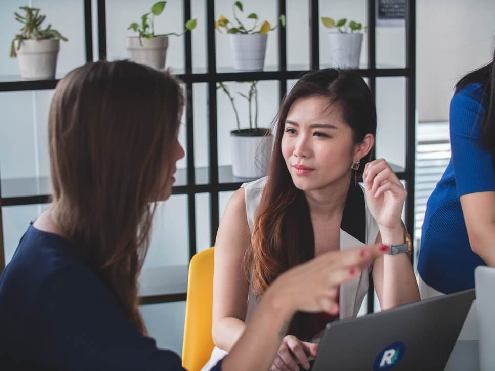 Woman talking to another woman - How to answer awkward questions with ease