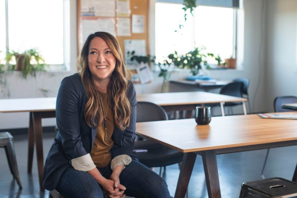 woman in black blazer sitting on a chair - Personal and professional development