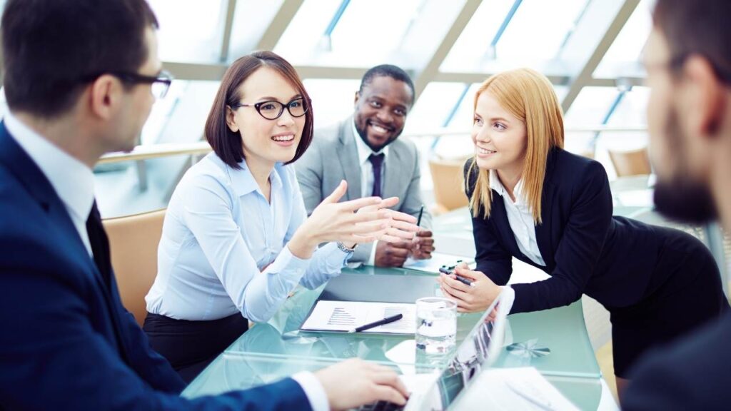 A group of business people having a meeting - Confidence in Business