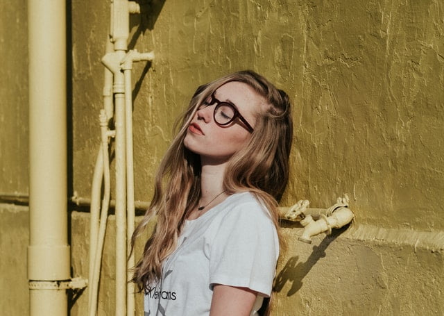 Blonde woman with glasses - Is it bad to be a shy person?